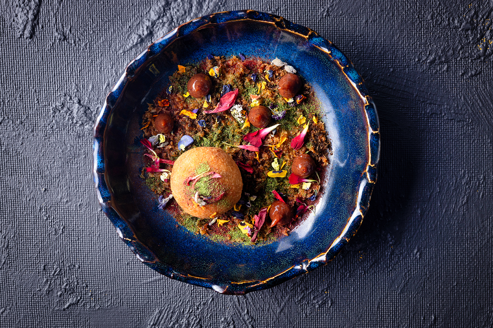 Fine dining plate with layered textures and garnish